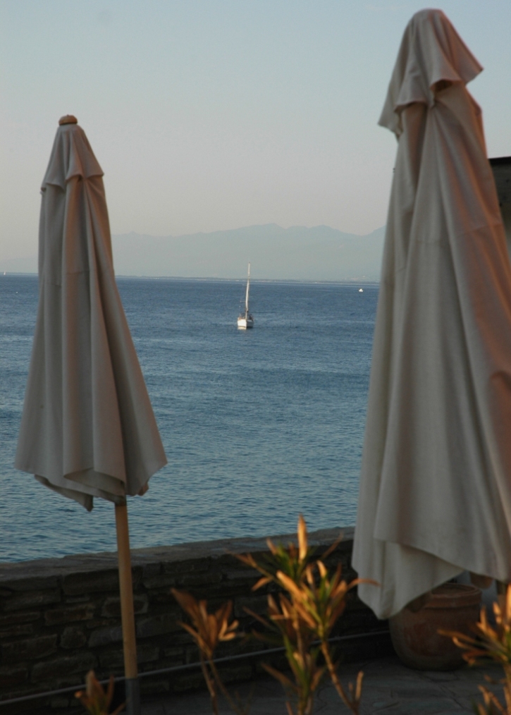 Boat between the beach umbrellas