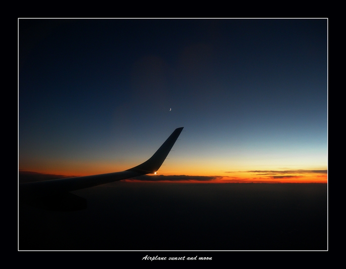 Airplane sunset and moon