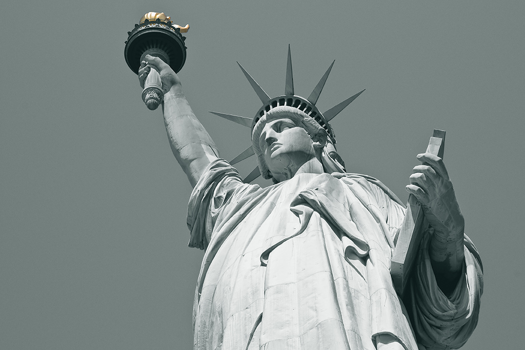 I lift my lamp beside the Golden Door