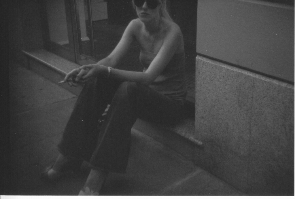 There was a girle sitting on the street...