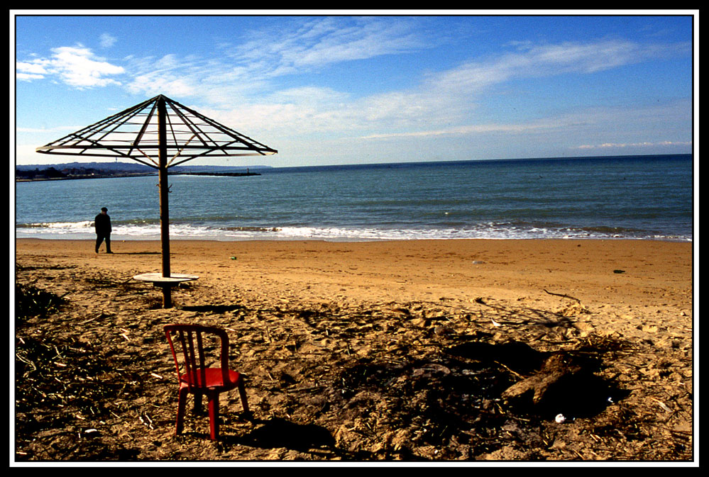the man the chair and the ombrella