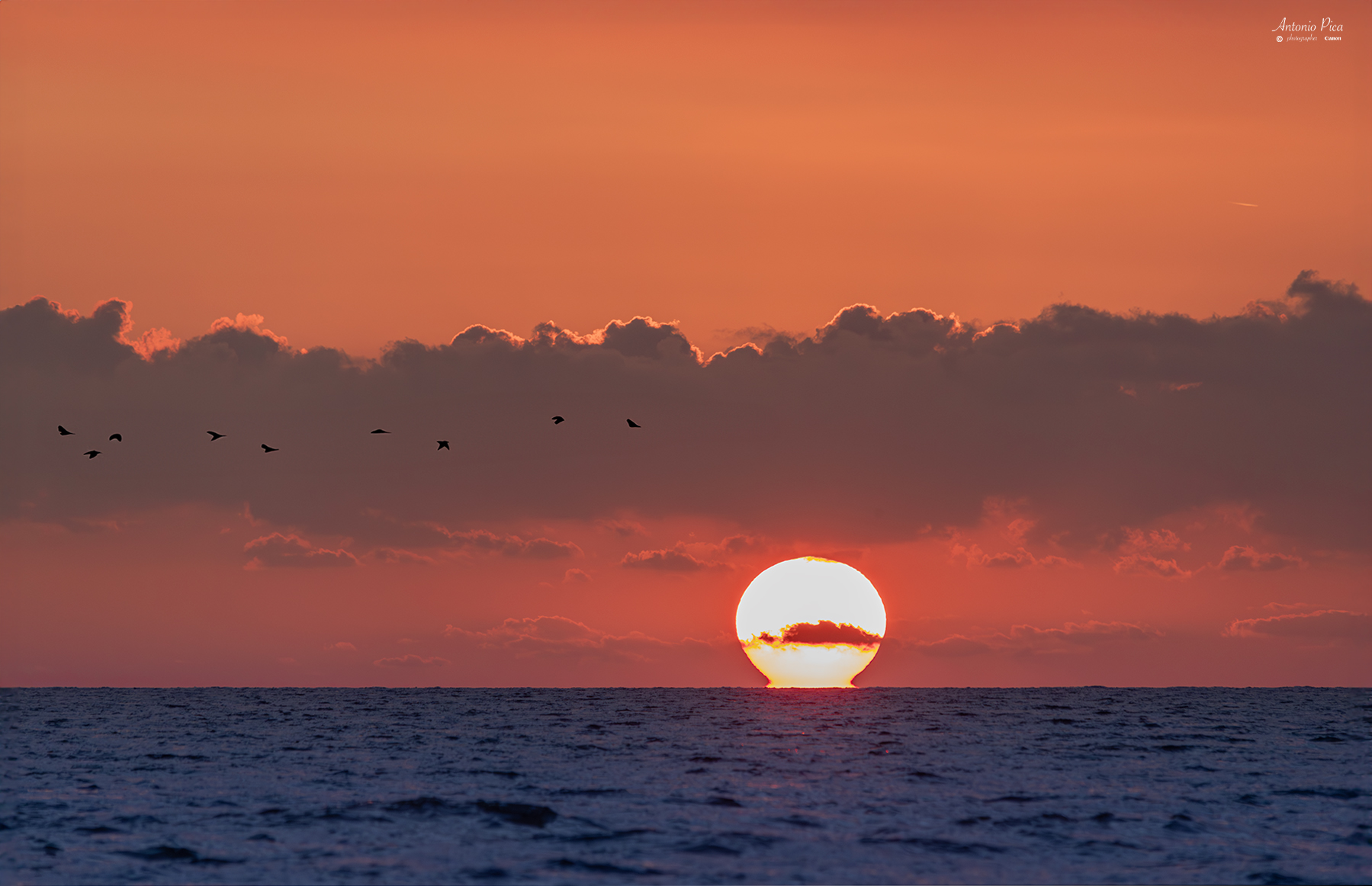 Tramonto con sole ad Omega